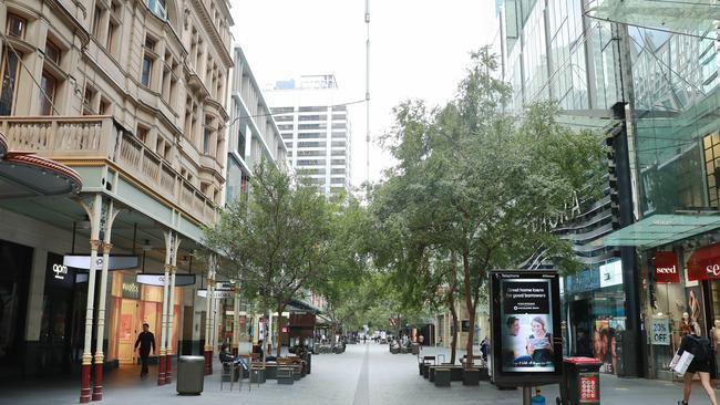 An empty Pitt Street Mall in Sydney. By Friday, office workers have disappeared from city centres. Picture: John Feder.