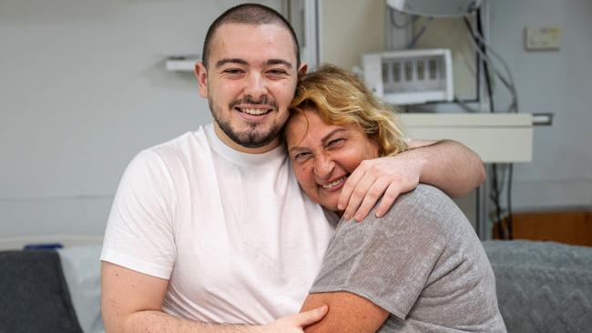 A handout picture released by the Israeli Army on June 8, 2024, shows Almog Meir Jan, 22-years-old, being hugged by his close relative at the Sheba Tel-HaShomer Medical Centre, after his rescue from the Gaza Strip by the Israeli army, in Ramat Gan near Tel Aviv on June 8, 2024, amid the ongoing conflict in the Palestinian territory between Israel and the militant group Hamas. Picture: AFP