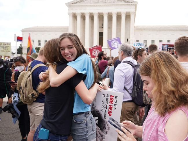 Anti-abortion activists hug outside the US Supreme Court in Washington, DC, on June 24, 2022. Picture: Mandel Ngan / AFP.