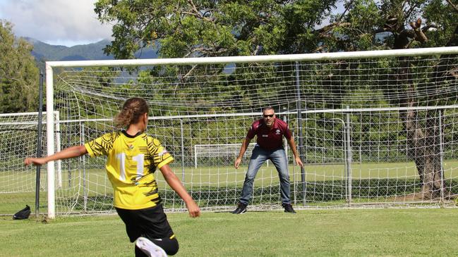 ALP candidate Matt Smith defending a junior football player. Picture: Supplied.