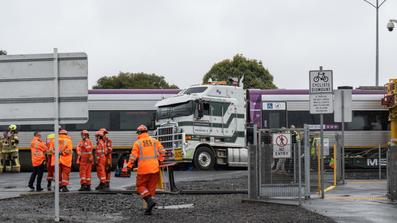 Emergency services at the scene of a fatal collision at a level crossing in North Shore. Picture: Brad Fleet