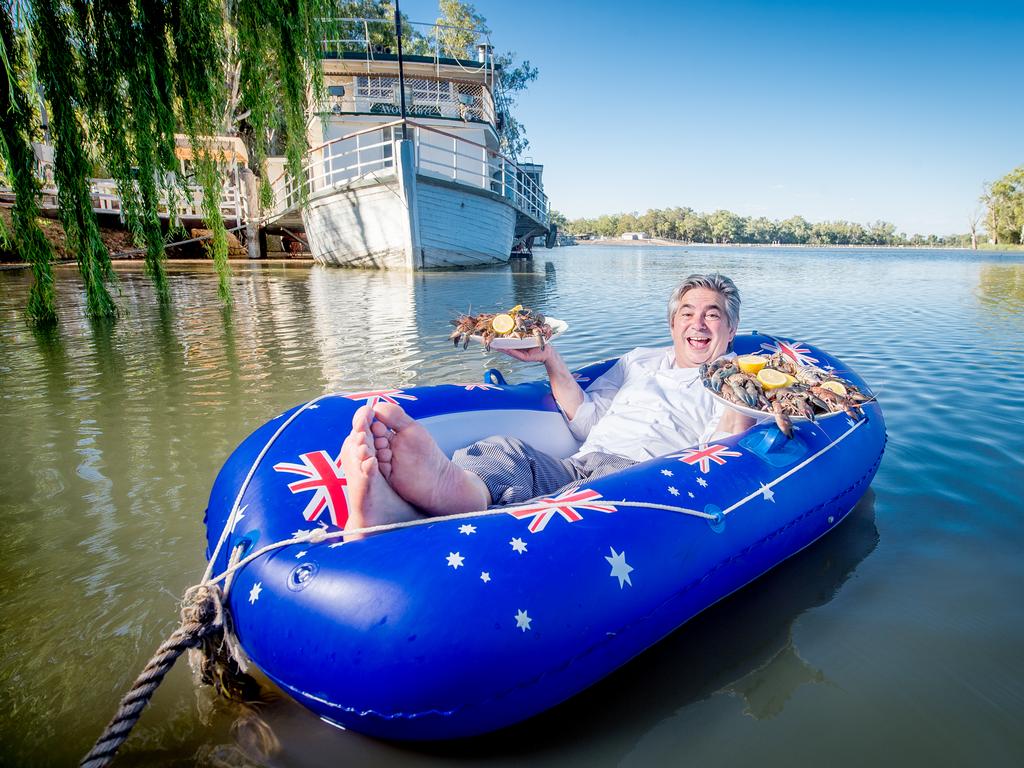 The famous Mildura chef was a bit hesitant about getting into the blow-up dinghy. In the background is Stefano’s next project restoring the Avoca. pictures: Jason Edwards