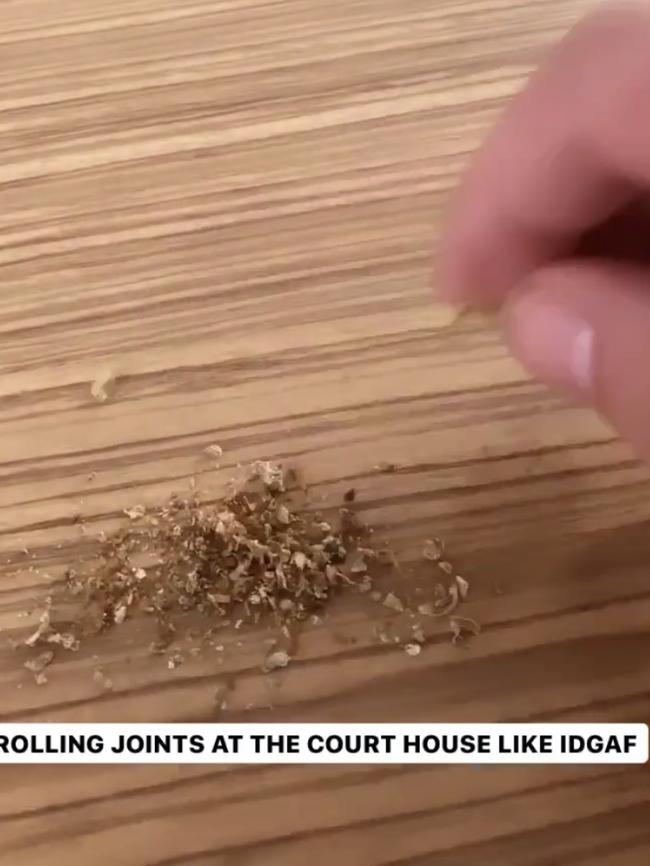 He appears to sprinkle cannabis on a court counter.