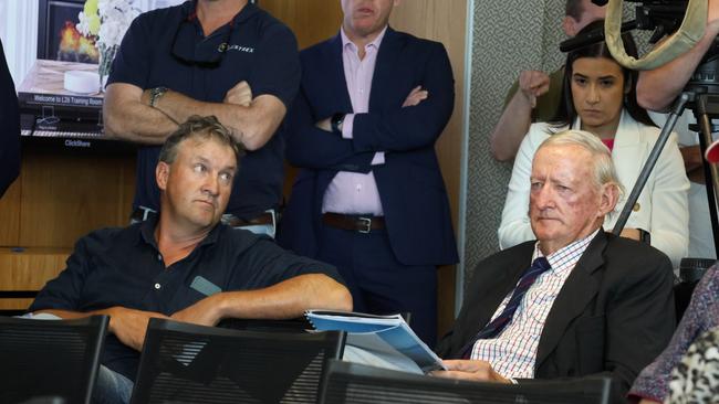 Will Cameron and his father, former politician Ian Cameron, mid-auction. Picture: Mackenzie Scott