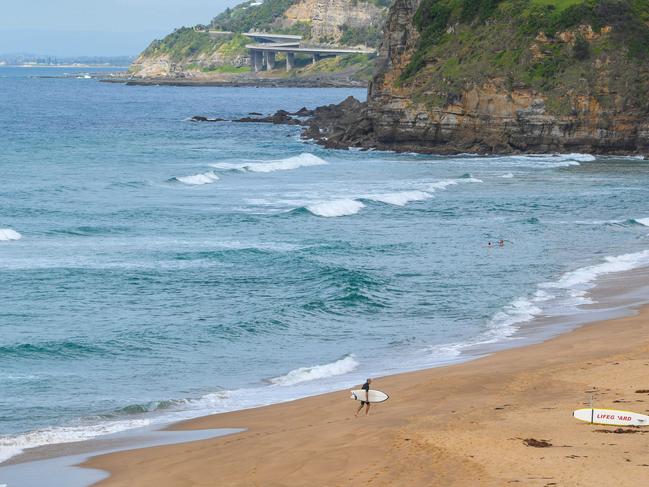 WOLLONGONG, AUSTRALIA - NewsWire Photos March 11, 2021. A few locals enjoy the mid-week quiet time at Stanwell Park beach north of Wollongong as the sun does itÃs best to break through.Picture: NCA NewsWire / Simon Bullard.