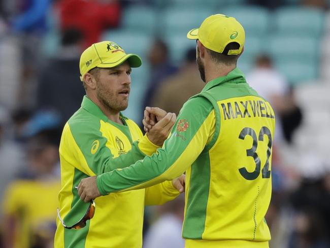 Aaron Finch celebrates with Glenn Maxwell after securing victory over Sri Lanka.