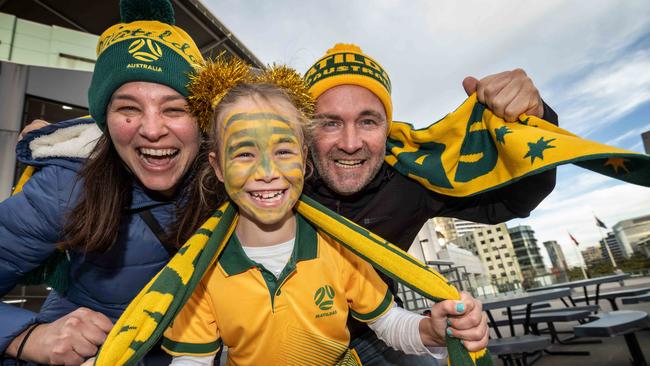 Matilda’s fans flocked to Marvel Stadium for the friendly against France. Pictured Lee Zerner an Dave Williams with Emmy, 8. Picture: Tony Gough