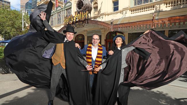 Harry Potter cast members Lucy Ansell and Damien Avery, with Minister for Events Martin Pakula, outside the Princess Theatre in Melbourne. Picture: Alex Coppel.