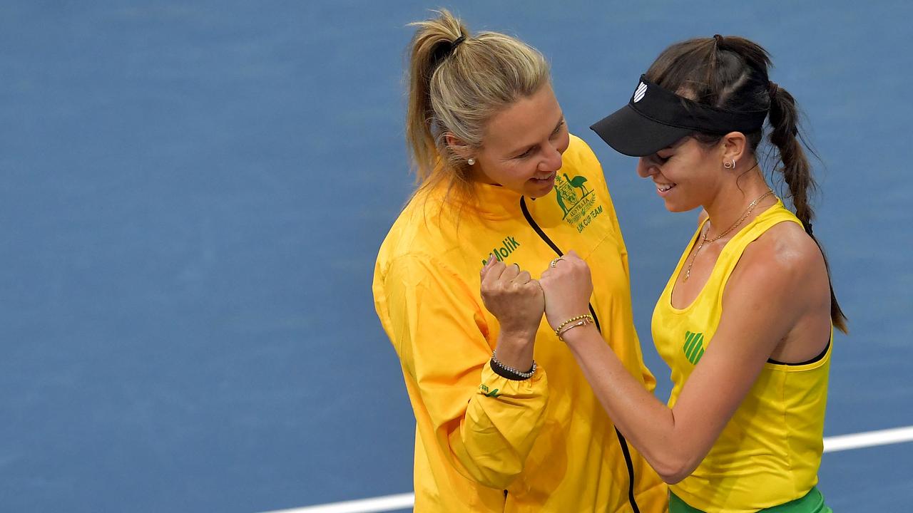 Ajla Tomljanovic celebrates with Australia's team captain Alicia Molik. Picture: Michal Cizek / AFP