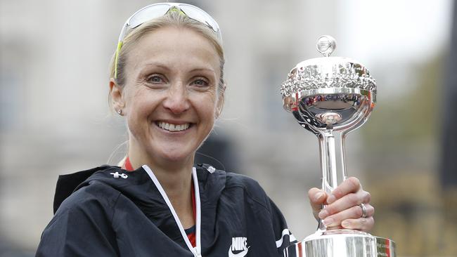 FILE- In this Sunday, April 26, 2015 file photo, British athlete Paula Radcliffe smiles after she was presented with a lifetime achievement award during the 35th London Marathon. Marathon world record holder Paula Radcliffe is skeptical whether Russian athletics has done enough to clean up its drug-testing program in time for the Olympics in Rio, and doubtful that athletes would know how to “train without cheating” if allowed back. The International Association of Athletics Federations has laid down a series of criteria for the Russians to meet before they can be eligible for readmission, and is scheduled to hold a news conference on Friday. Speaking to The Associated Press on Thursday, March 10, 2016 in the lobby of the Fairmont Hotel in Monaco, where Friday’s news conference will be held, Radcliffe spoke of her shock at watching ARD’s “very damaging” revelations. (AP Photo/Kirsty Wigglesworth, file)