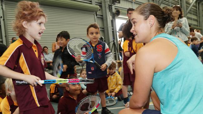 Australian tennis players Lizette Cabrera, Ash Barty, John Millman and John-Patrick Smith in Cairns. Ash Barty gives out tennis racquets to Edge Hill State School prep students including Emma Shields. PICTURE: STEWART McLEAN.