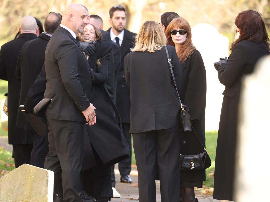 Mourners were seen comforting each other ahead of the service. Picture: Dan Kitwood/Getty Images