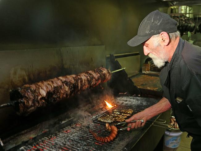 Top chef Lazaros Tsakiridis tends to the grill at Jim's Greek Tavern. Picture: Hamish Blair