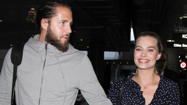 Margot Robbie makes smitten LA arrival with husband Tom Ackerley ...