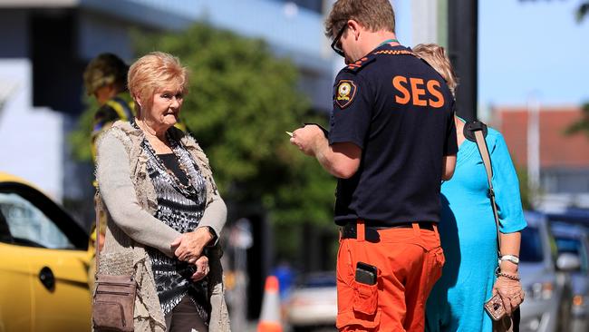 Pedestrian foot traffic is stopped and checked for border passes as Queensland steps up its tightened security with Covid restrictions. Picture: Scott Powick.