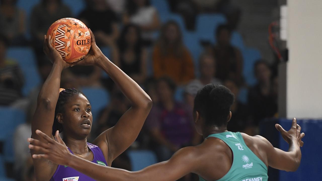 CAIRNS, AUSTRALIA – SEPTEMBER 20: Romelda Aiken of the Firebirds looks to pass the ball past Kadie-Ann Dehaney of the Vixens during the round 13 Super Netball match between the Melbourne Vixens and the Queensland Firebirds at the Cairns Pop Up Arena on September 20, 2020 in Cairns, Australia. (Photo by Ian Hitchcock/Getty Images)