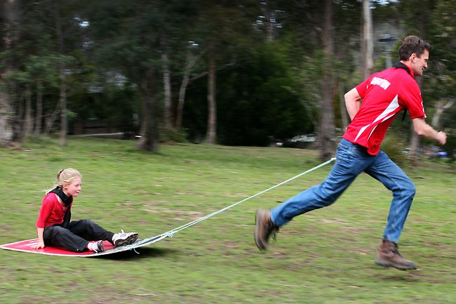 <p>Shaun Kingston, of Smithton ,Scouts, racing down hill with Taryn Bennet, of Blackmans Bay. Picture: Kim Eiszele</p>