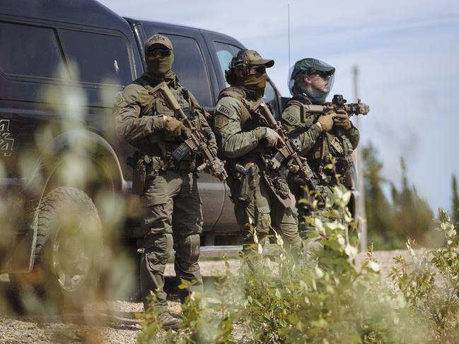 Members of the Royal Canadian Mounted Police (RCMP) Emergency Response Team. The pension fund for the RCMP has spent $4.5bn on Australian agriculture assets in recent years. Picture: Angus Mordant