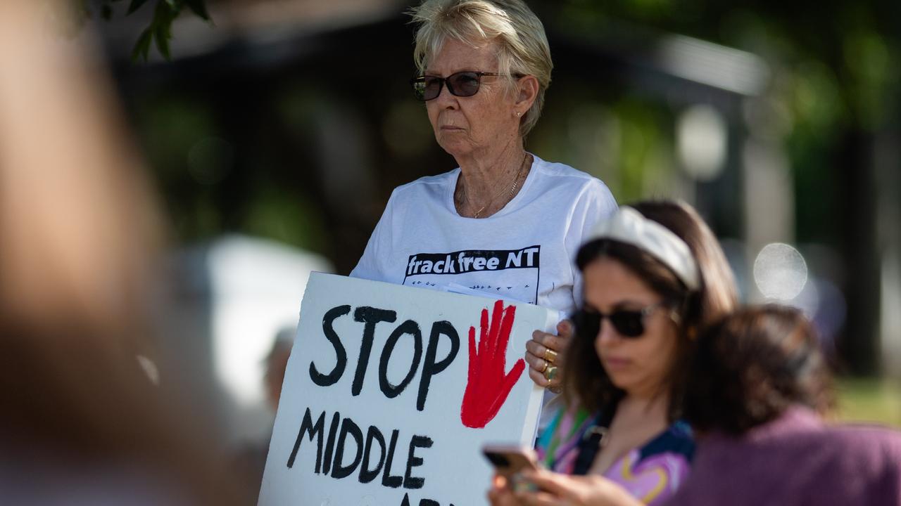 More than a hundred gathered to protest Middle Arm ahead of the second day of public hearings about the proposed development in Darwin. Picture: Pema Tamang Pakhrin