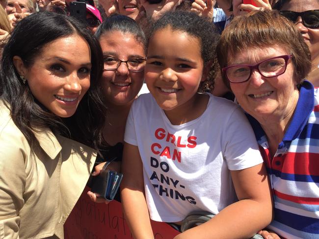 Prince Harry took this photo of his wife Meghan with Sethunya Gibbons and her cousin Rebecca Szekeres and Grandma Sharon Gibbons.