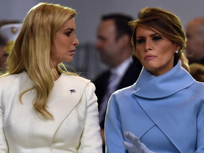 US First Lady Melania Trump speaks with Ivanka Trump during the presidential inaugural parade for US President Donald Trump on January 20, 2017 in Washington, DC. / AFP PHOTO / Nicholas Kamm