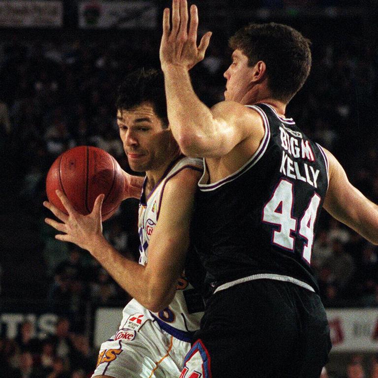 Mike Kelly (right) in action for South East Melbourne Magic during the 1996 NBL season.