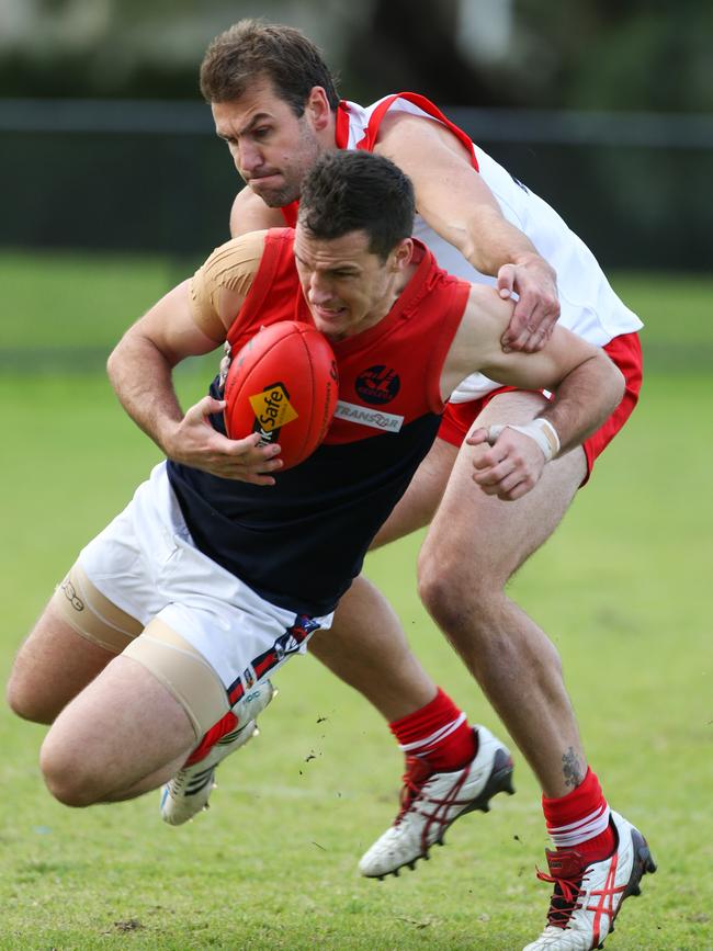 2015: Mt Eliza's Scott Lockwood is caught by Karingal's Luke Van Raay. Picture: David Trend