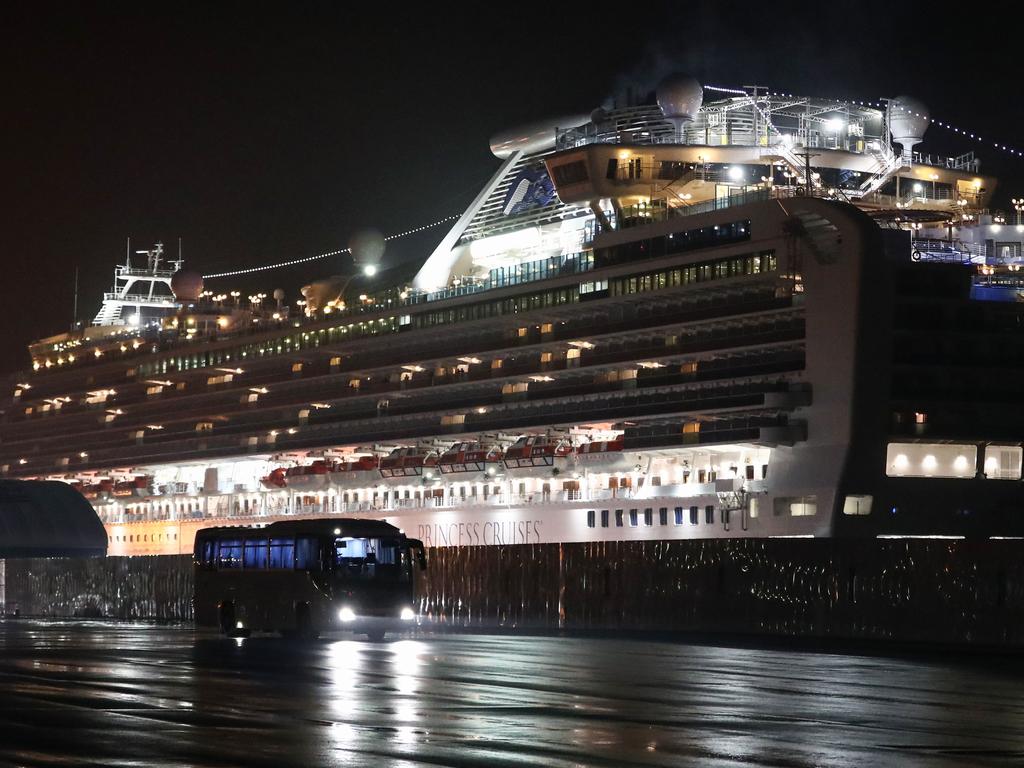 A bus carrying US citizens leaves the port at Yokohama earlier this month. Picture: Behrouz Mehri/AFP