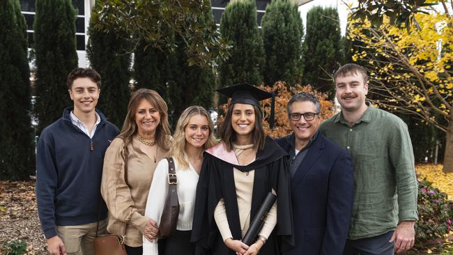 Bachelor of Education (Primary) graduate Christalla Fatseas with (from left) Ted Fatseas, Maria Fatseas, Anastasia Fatseas, Steve Fatseas and Harry Claydon at a UniSQ graduation ceremony at The Empire, Tuesday, June 25, 2024. Picture: Kevin Farmer