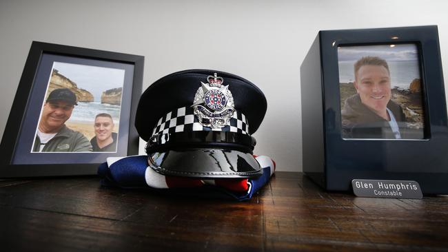 Constable Glen Humphris's police hat sits on an Australian flag. Picture: David Caird