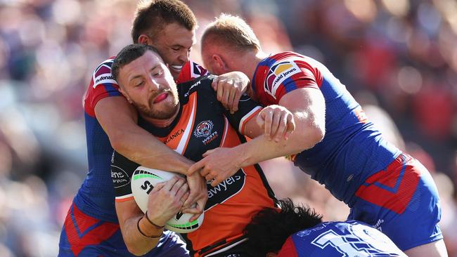 Jackson Hastings taken down by two Knights (Photo by Cameron Spencer/Getty Images)