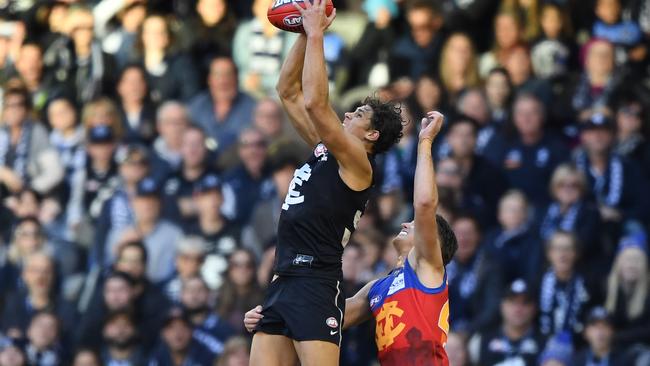 Charlie Curnow takes a mark against Brisbane last week as Carlton fans watch on. Picture: AAP