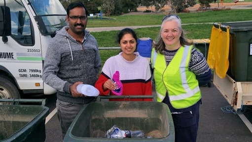 Northern Community Recycling Group’s Ann Williams (right) with Hume residents diverting their recyclables from landfill during the city's first fortnightly pop-up collection day at Craigieburn. Picture: Supplied