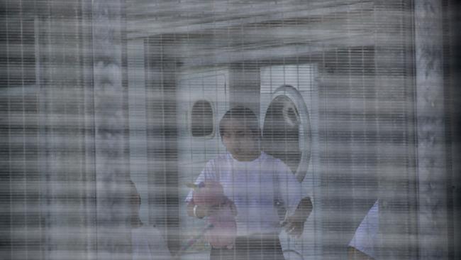 Washing day: Wuhan evacuees at North West Point detention centre, Christmas Island. Picture Colin Murty