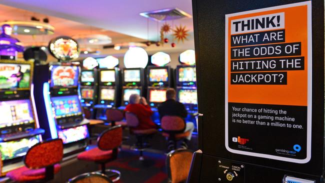 Several AFL clubs have profited from poker machines. Pic: AFP