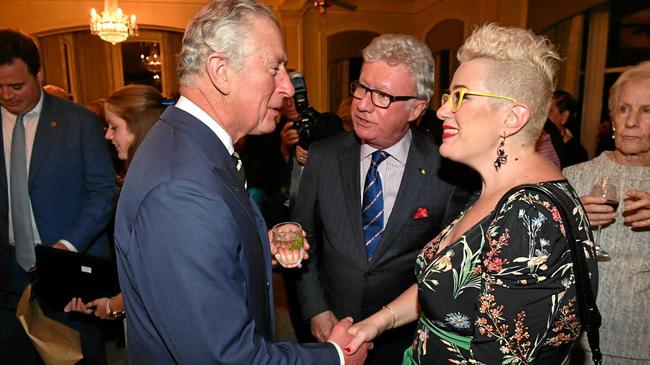 WOW FACTOR: Britain's Prince Charles meets with Australian Singer Katie Noonan at a reception at Queensland Government House in Brisbane. Picture: MICK TSIKAS