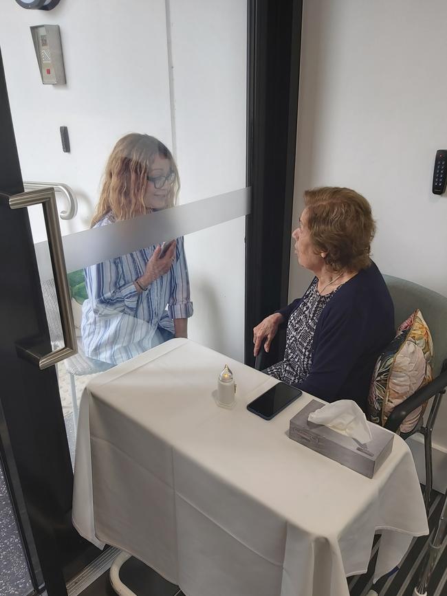 Rosa Nathanael (daughter) and her mum, Hrisavgi (Avgi) Nathanael do a window visit at St Basil's Homes, an initiative created to keep residents connected with family during the coronavirus lockdown.