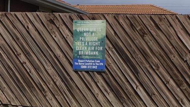 Nicole Power of St Albans erected this sign on her fence to protest the smell coming from Barro Group's Kealba landfill.