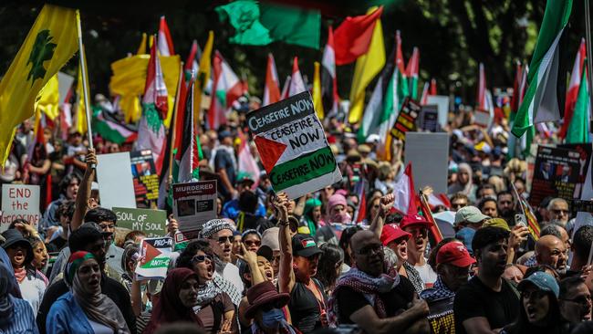 SYDNEY, AUSTRALIA - OCTOBER 06: Pro Palestine supporters chant a slogan during a protest at Hyde Park on October 06, 2024 in Sydney, Australia. Organizers of pro-Palestine protests in Sydney are set to proceed with a rally on Sunday, October 6, despite legal attempts by police to prohibit the gatherings due to safety concerns related to anticipated crowd sizes and potential disruptions. The following day, a vigil is scheduled to honor victims of violence in Gaza, coinciding with the one-year anniversary of the Hamas attacks, which has drawn criticism from government officials who deem the timing "extremely provocative". Protesters also planned to gather for similar events in Melbourne. (Photo by Roni Bintang/Getty Images)