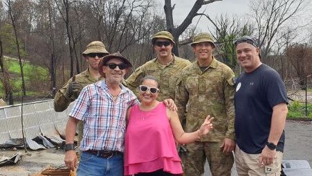 Lorena Granados (in pink shirt) with helpers after the bushfires.