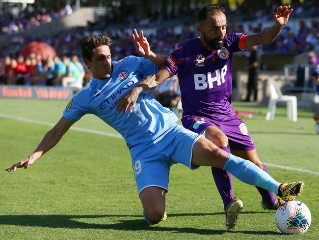 Diego Castro of Perth Glory is tackled by Lachlan Wales of Melbourne City during the Round 22 A-League match between the Perth Glory and the Melbourne City at HBF Park in Perth, Sunday, March 8, 2020. (AAP Image/Gary Day) NO ARCHIVING, EDITORIAL USE ONLY