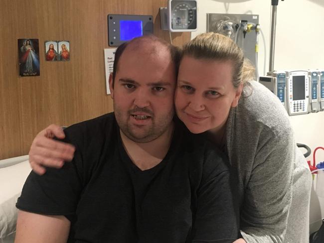 Eric Bicchieri with his mother Sharon Leslie in hospital.