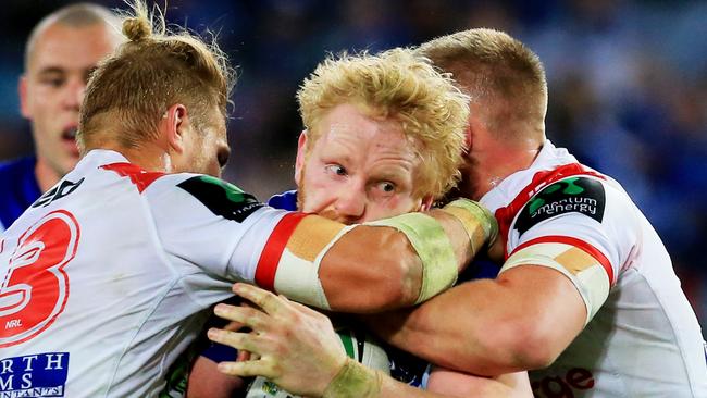 James Graham of the Bulldogs tackled during the Canterbury Bulldogs v St George Illawarra Dragons round 21 NRL game at ANZ Stadium, Sydney Olympic Park. pic Mark Evans