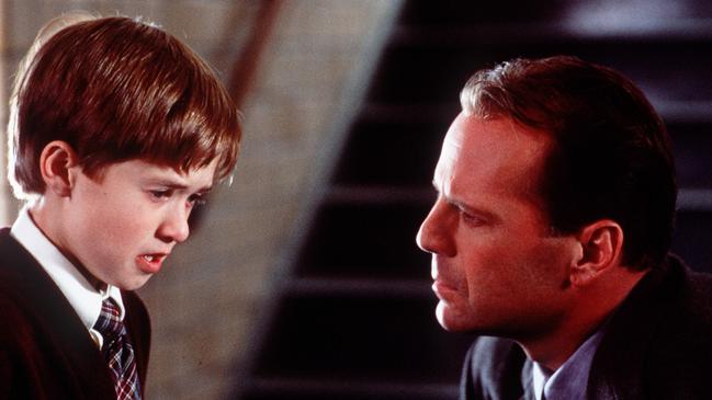 Actors Haley Joel Osment and Bruce Willis in a scene from 1999 film The Sixth Sense.