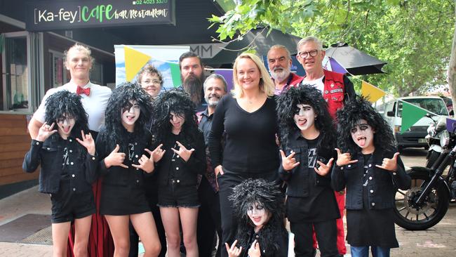 Lord Mayor Nuatali Nelmes with Ka-fey Café owner Lucy Glover, Circus Avalon, young Kiss impersonators and Santa Toy Run participants in Hunter Street Mall at the launch of the Enjoy Newcastle program. Supplied Newcastle Council