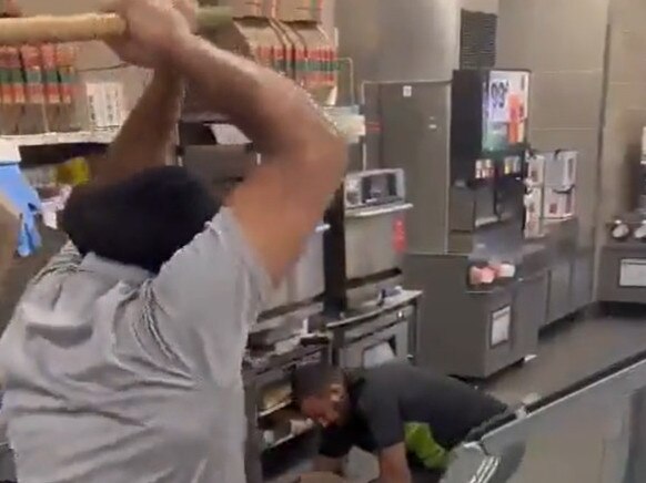 Viral video shows an alleged thief being beaten with a stick by two 7-Eleven store clerks in Stockton, California. Picture: Twitter