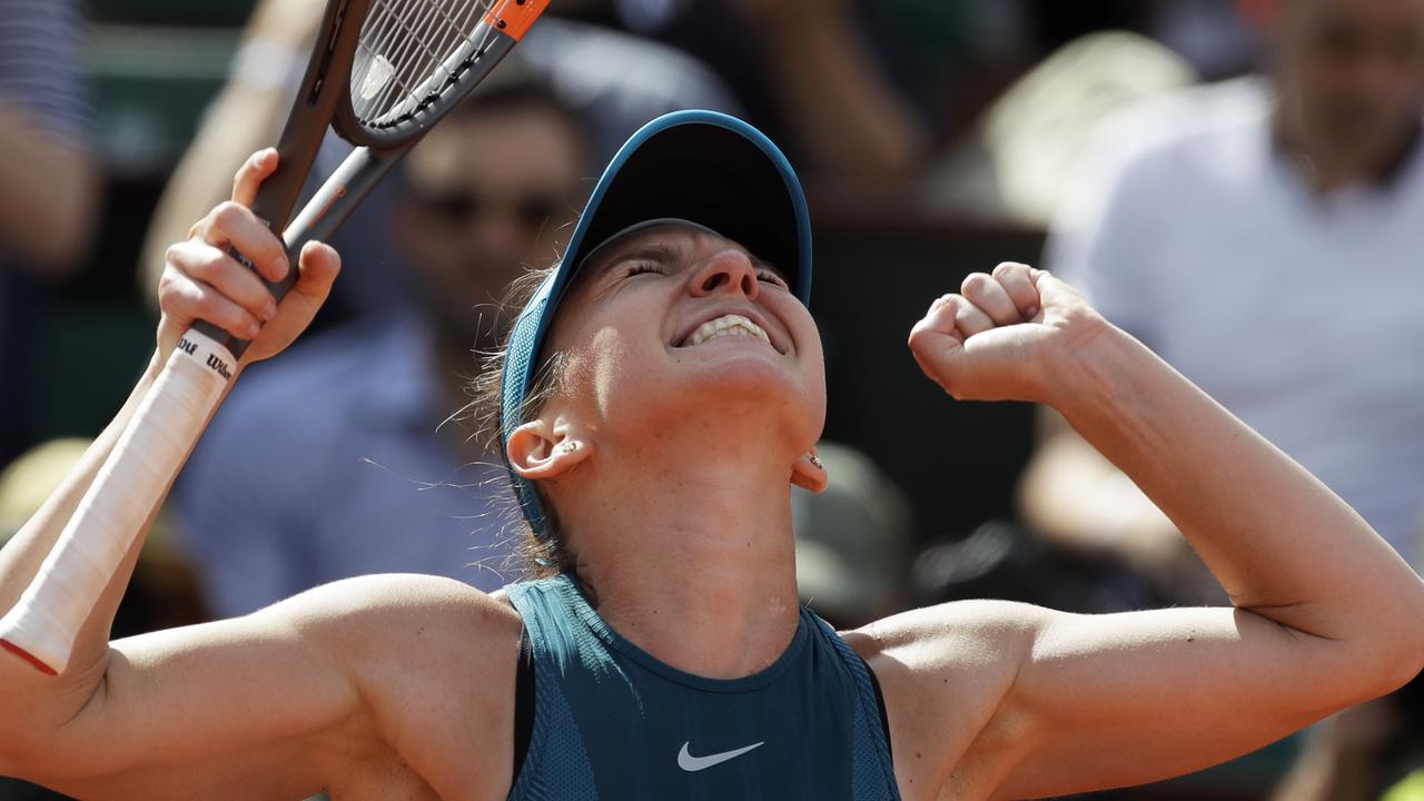 Simona Halep celebrates beating Garbine Muguruza in their French Open semi-final