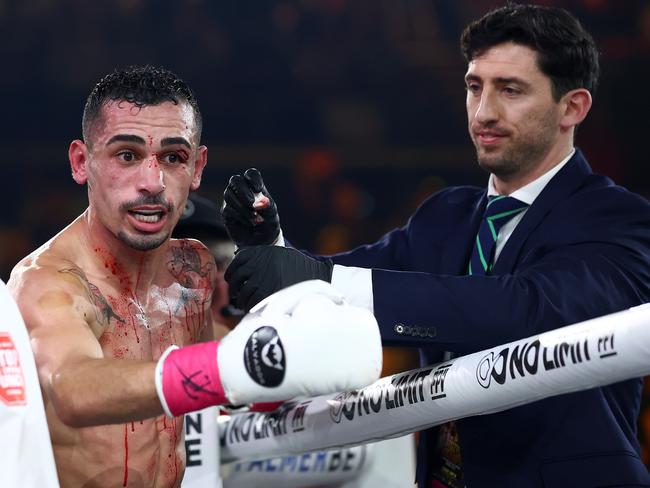 Hamdan looks to his corner as the ringside doctor said he’d stop his fight with Justin Frost. Picture: Chris Hyde/Getty Images