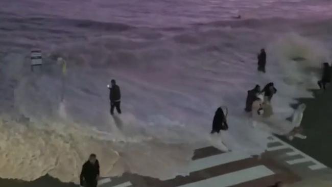 A wave washes over the promenade at Bondi Beach. Picture: Channel 9