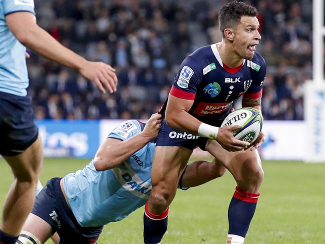 SYDNEY, AUSTRALIA - APRIL 24: Matt Toomua of the Rebels is tackled during the round 10 Super RugbyAU match between the NSW Waratahs and the Melbourne Rebels at Bankwest Stadium, on April 24, 2021, in Sydney, Australia. (Photo by David Neilson/Getty Images)